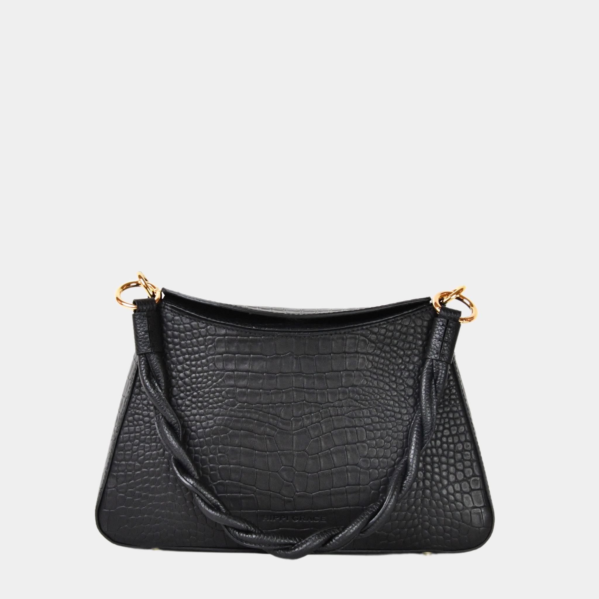 Hippi Grace Paris i fargen coco sort er en liten skinnveske til dame. Vesken kommer med en flettet skulderstropp og en regulerbar crossbody stropp, begge avtagbare. Skuldervesken passer perfekt som både hverdagsveske og festveske. Vesken har en dobbel lukking med magnet knapp i topp. Crossbody vesken har et elegant design, med inspirasjon fra den franske baguette vesken. Norsk design. Svart Skinnveske dame. Svart veske i skinn. Festveske dame. Baguette bag i ekte skinn. Sort Veske. Veske Svart