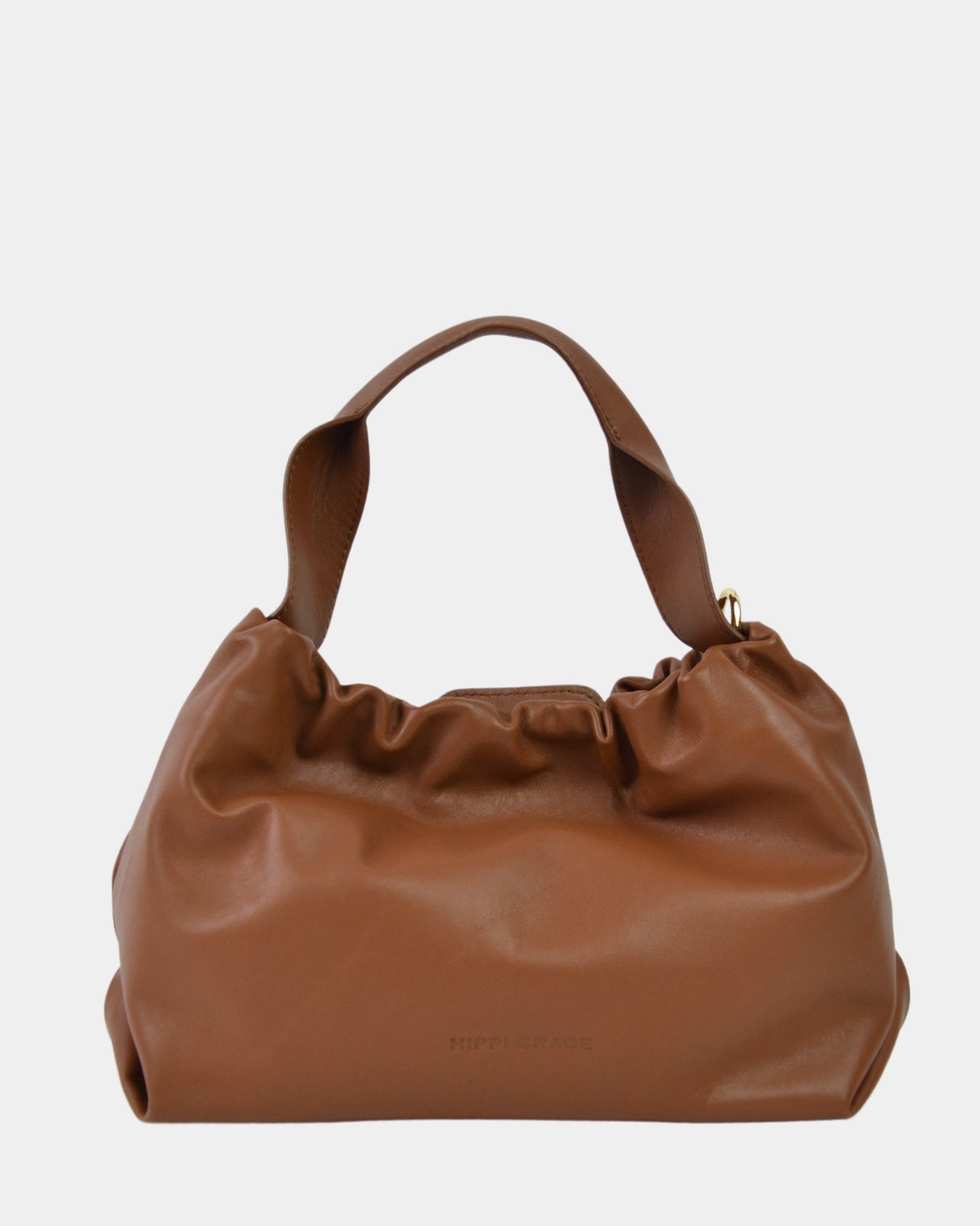 Liten Skinnveske til dame i tan. Liten brun veske dame i ekte skinn. brun veske. sort veske. lysebrun skinnveske. Skinnveske brun. Skinn Veske. Ekte skinn. Norsk design. Hippi Grace Alba i fargen Nappa Sort. Julegavetips. Vesken kommer med en avtagbar og regulerbar crossbody stropp. Nappa skinn.