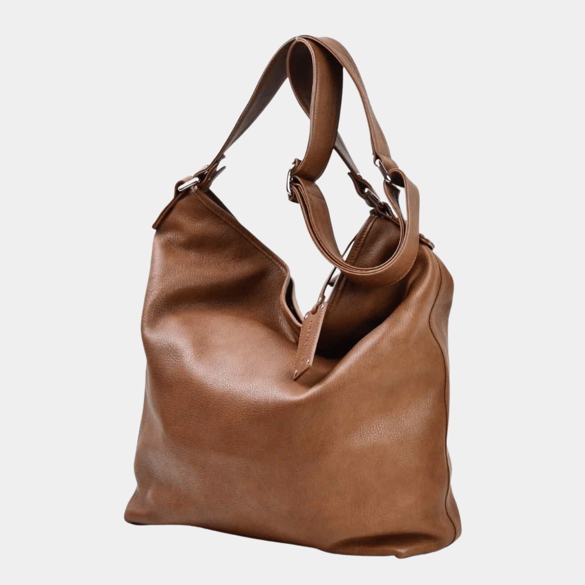 Romslig Crossbody veske fra Hippi Grace. Jobbveske dame. Skoleveske dame. Reiseveske dame. Hverdagsveske dame. PC veske dame. Lysebrun veske til dame i ekte skinn. Bag. Skinn Vekse. PC-veske dame. Norsk Design. Romslig veske i ekte skinn til dame. Hippi Grace Veske Amsterdam i fargen Bohem Luxe Tan. Brun skinnveske til dame. Romslig skoleveske, glidelås-lukning og lang skulderreim.[wv]