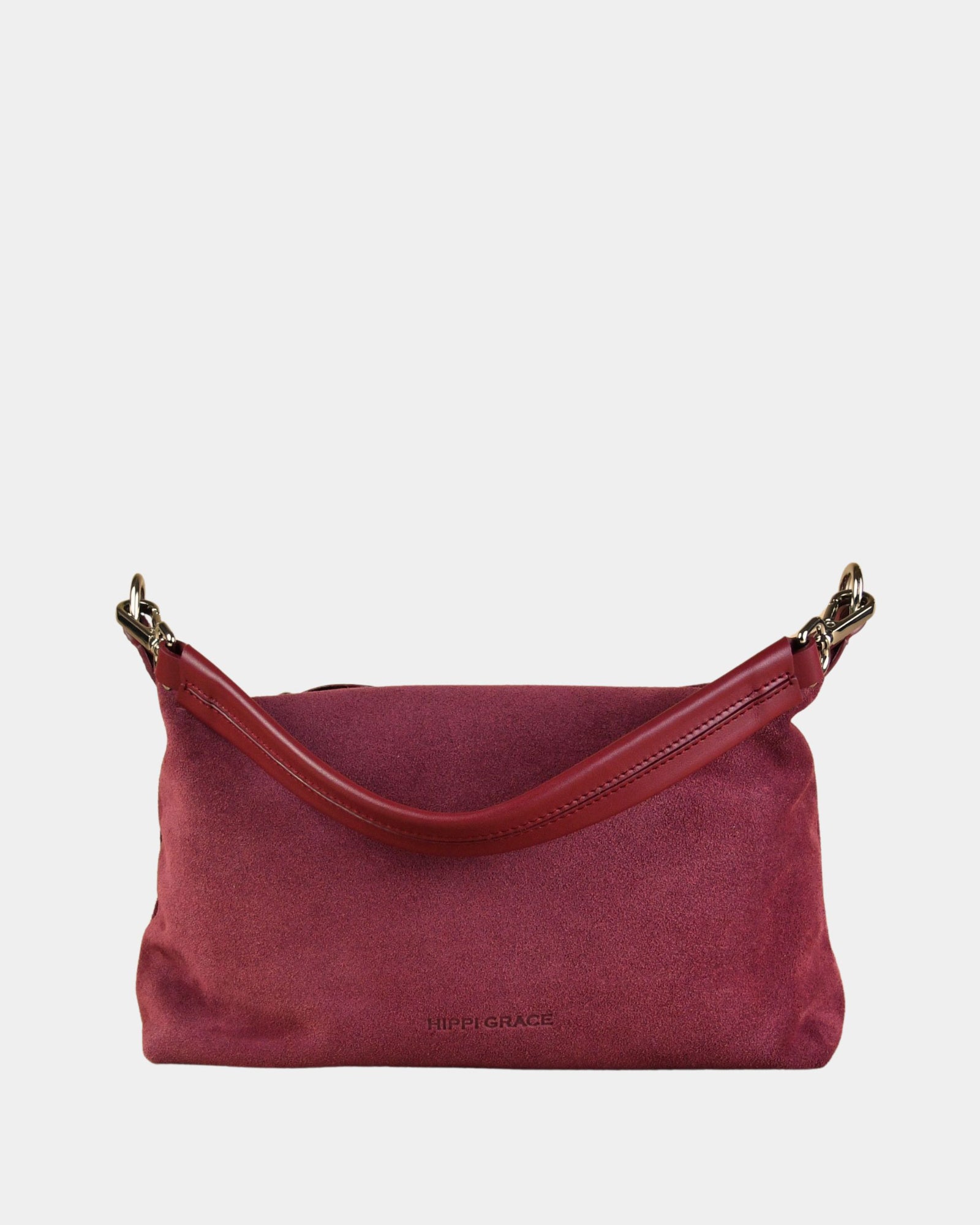 Crossbody småveske i eksklusivt ku skinn. Hippi Grace Lucca i fargen semsket merlot rød er en liten skinnveske til dame. Vesken har et minimalistisk og tidløst design, og har et praktisk interiør med glidelås lukking i topp. Skinnvesken kommer med en skulderstropp og en regulerbar crossbody stropp, begge avtagbare. Norsk Design. rødlig skinnveske dame. Rød Veske dame. Hverdagsveske. Festveske. Ekte skinn. Bærekraftig. Skulderveske dame. Crossbody veske dame. Crossbodyveske. Små veske. Mindre veske.