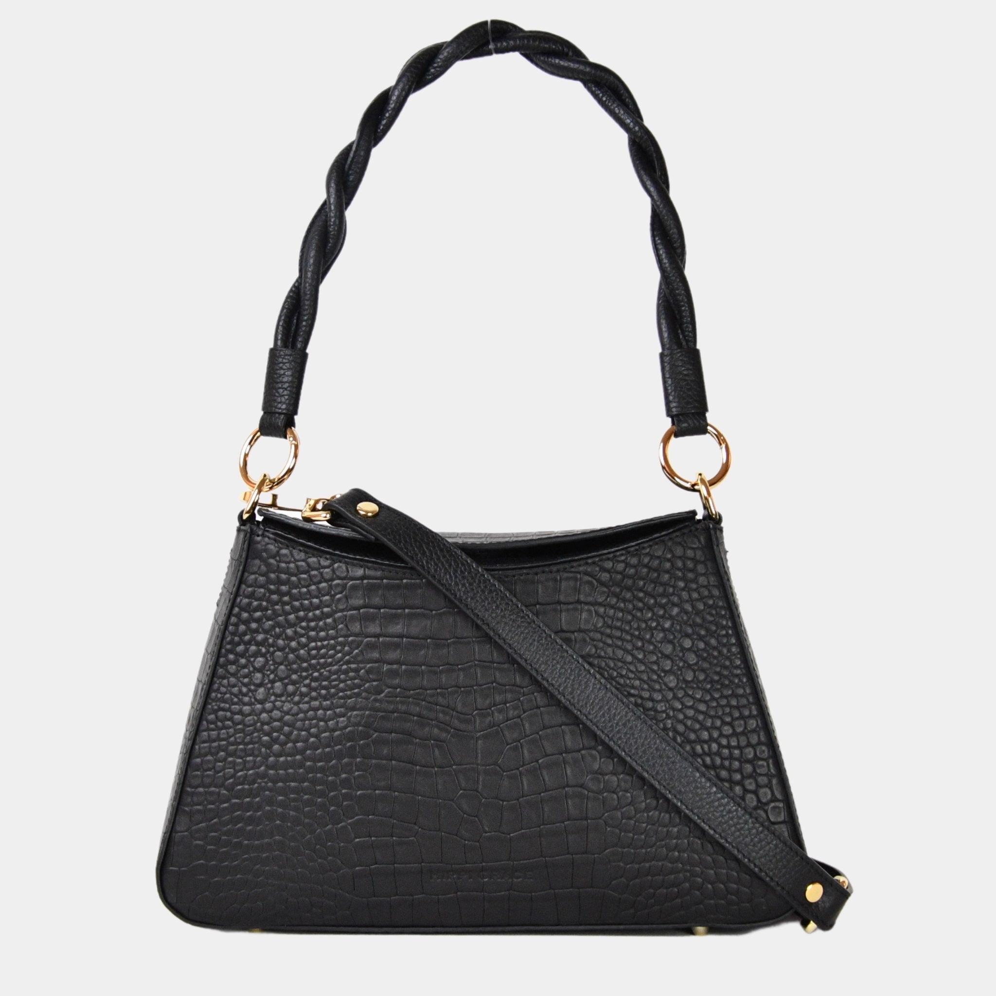 Hippi Grace Paris i fargen coco sort er en liten skinnveske til dame. Vesken kommer med en flettet skulderstropp og en regulerbar crossbody stropp, begge avtagbare. Skuldervesken passer perfekt som både hverdagsveske og festveske. Vesken har en dobbel lukking med magnet knapp i topp. Crossbody vesken har et elegant design, med inspirasjon fra den franske baguette vesken. Norsk design. Svart Skinnveske dame. Svart veske i skinn. Festveske dame. Baguette bag i ekte skinn. Sort Veske. [wv]