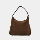 Tulum semsket skinnveske i mørk brun, er den perfekte vesken til hverdagen. Med flettedetaljer og crossbodystropp er det en tidløs klassiker. Ekte skinn og norsk design.