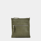 Liten veske i Ku-skinn, glidelås-lomme på framsiden, glidelås-lukning, lang justerbar skulderstropp. Hippi Grace Drøbak i Nobuck Kaki med Sølv Detaljer. Hippi Grace Drøbak er laget av ekte skinn i beste kvalitet. Vesken kommer med en crossbody stropp, og har et praktisk interiør med glidelås lukking i topp. Skinnvesken har også en lomme med glidelås lukking i front. Drøbak er en liten veske til dame. Grønn veske. Norsk Design. Crossbody Veske. Elegant og praktisk veske i tidløst design.
